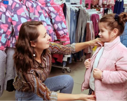 A woman shopping with her daughter.
